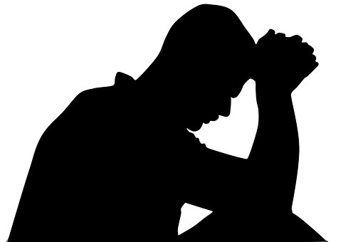 Man crying in the shadows