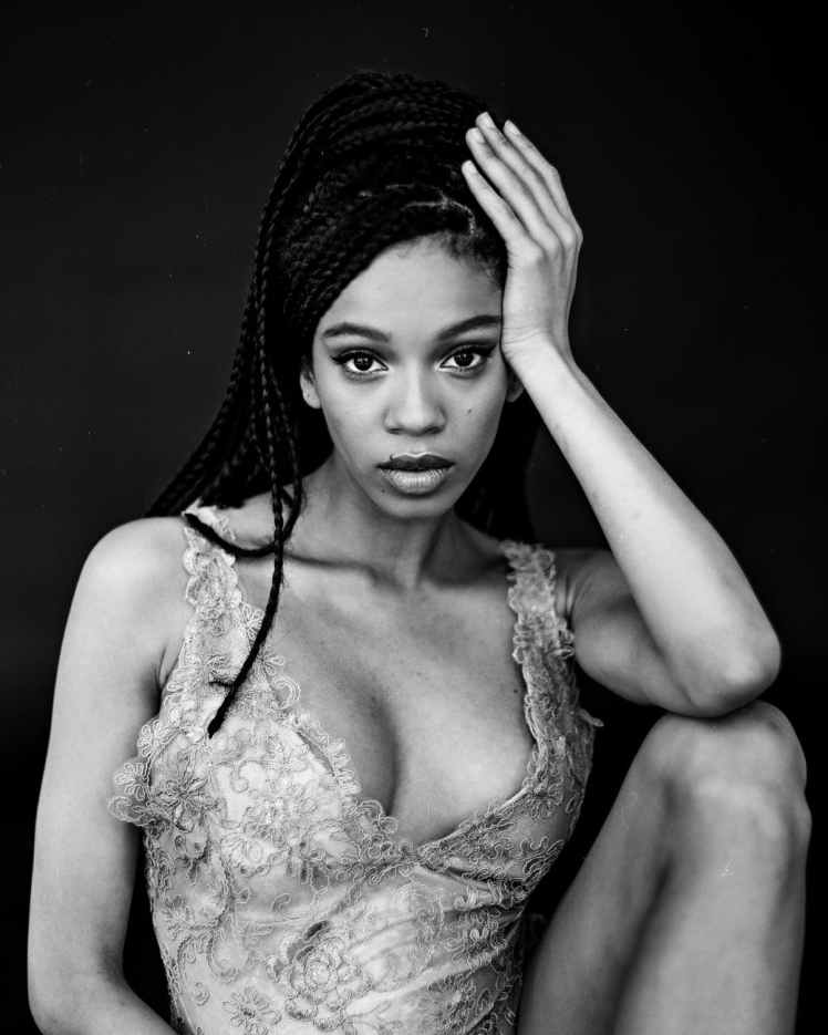 monochrome photo of woman wearing sleeveless top